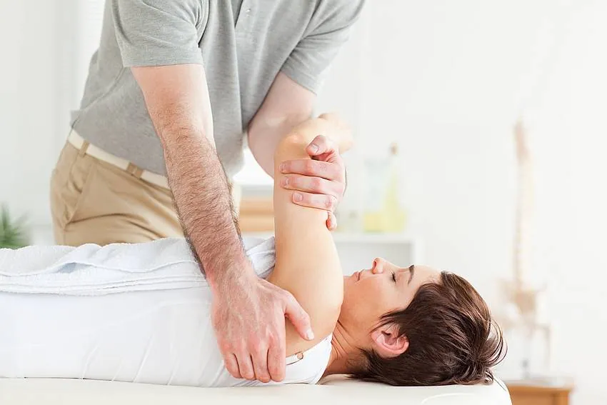 Practitioner treating a patient at Health Club