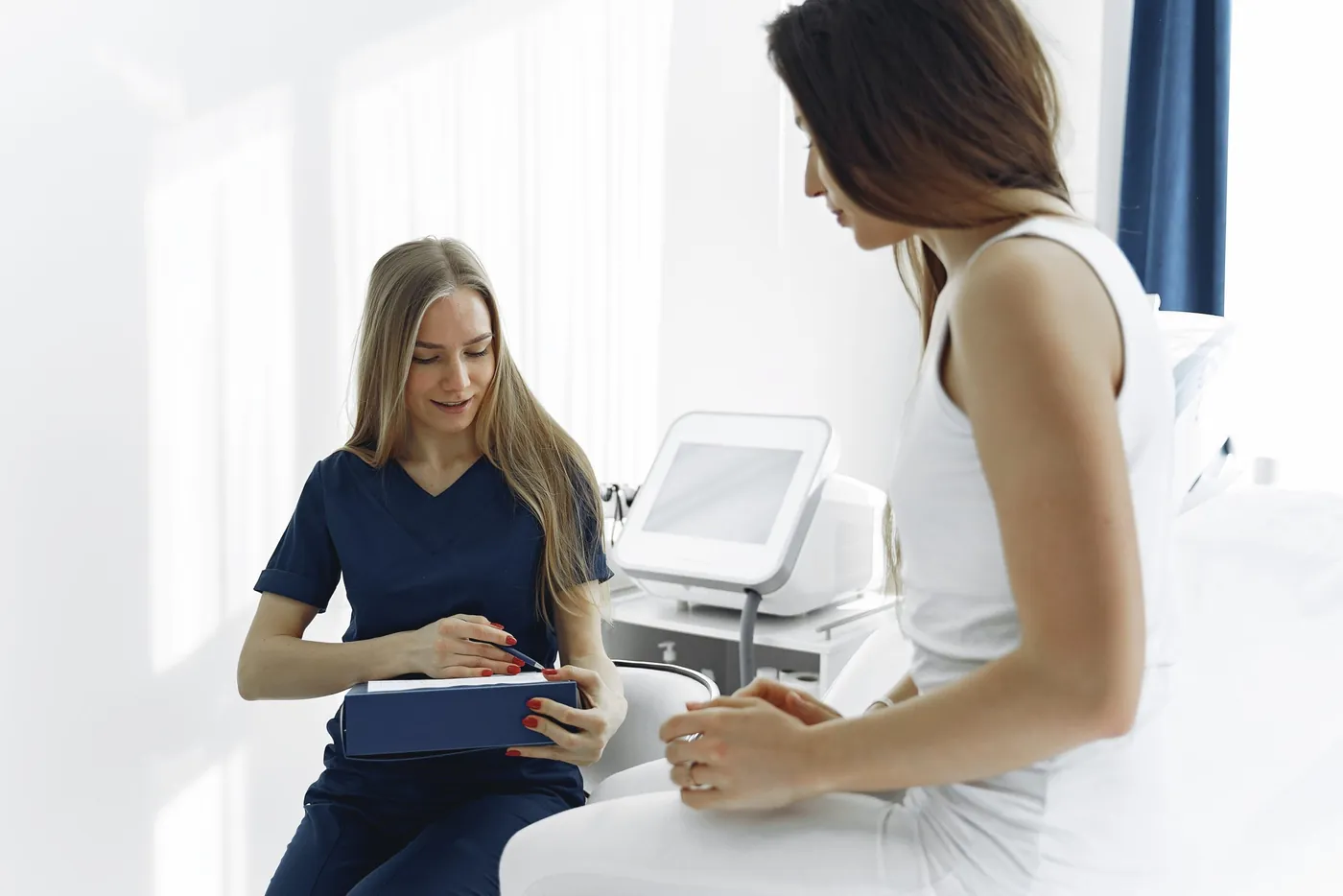 Woman getting pelvic treatment from physiotherapist